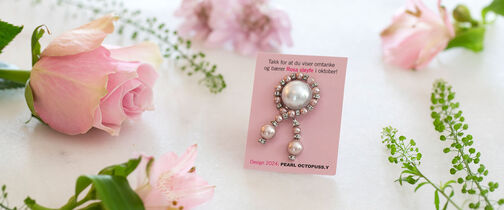 Rosa sløyfe pin